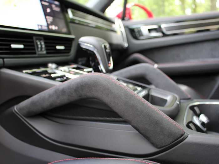 The grab handle is rendered in Alcantara. Note that there