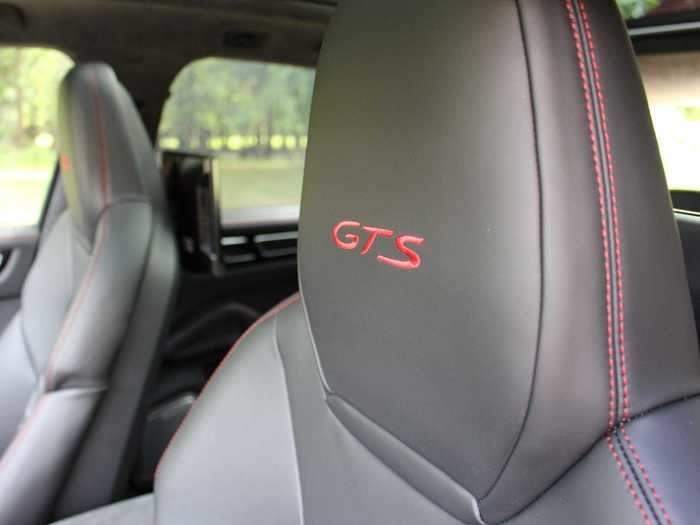 Carmine red topstitching on the black leather seats matches the exterior, as does the GTS call-out. (The seats are comfy for cruising, yet also sufficiently bolstered for spirited driving.)