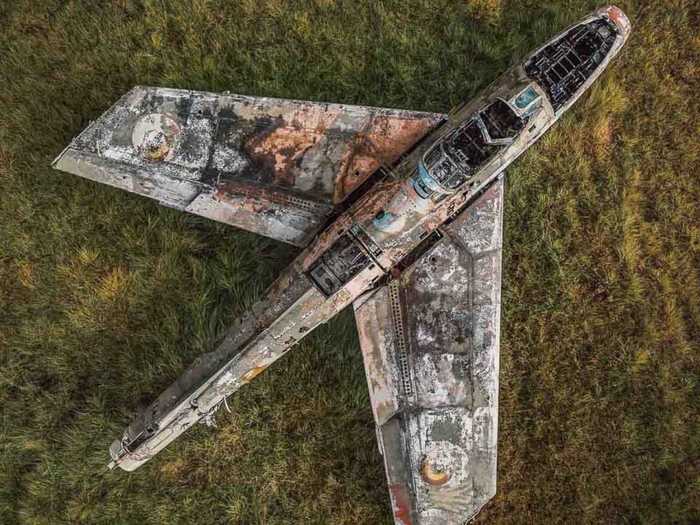 The term abstract is used more generally on the page, with some photos featuring easily identifiable subjects like this abandoned Cold War-era jet in a Belgian field,