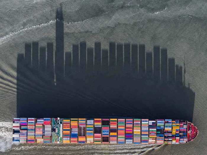 To capture this photo, aptly named "Skyline" thanks to the reflection of the containers on the river," the brothers drove through the night from the UK to the Netherlands to get the shot. They got lucky and only had to wait around 30 minutes before they completed their mission.