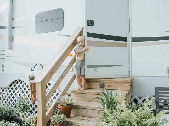 Because the RV is sitting in one place permanently, the Herndons were able to build steps and a porch leading into their home.