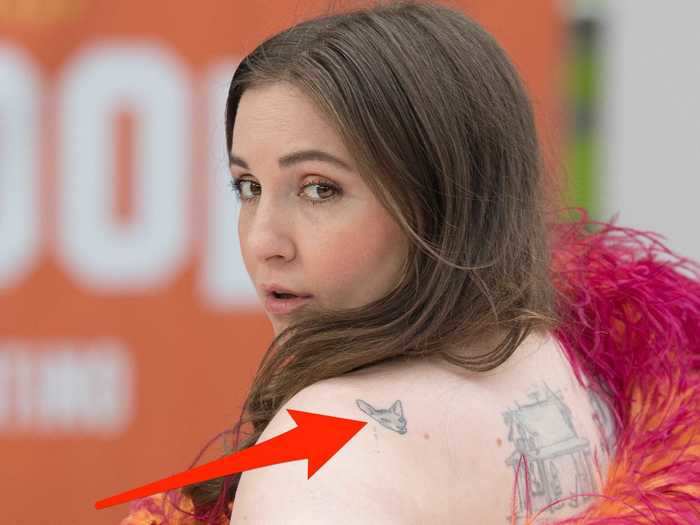 Lena Dunham has a small rendering of her late cat, Gia, on her shoulder blade.