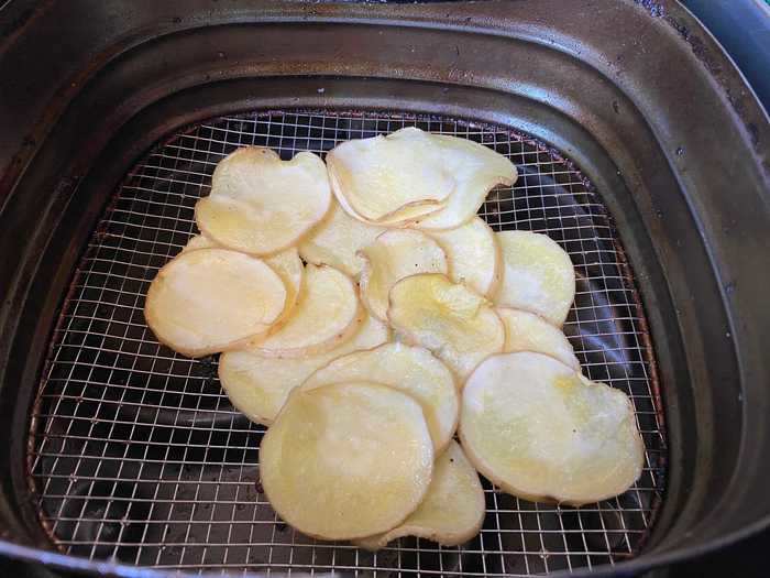 I placed two layers of chips in the air fryer and baked them for 20 minutes at 200 degrees Fahrenheit.