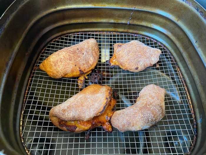 After a few minutes of cooking, some of the calzones erupted.