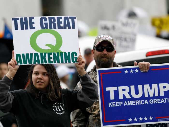 QAnon believers have become increasingly visible at Trump rallies and and at anti-coronavirus lockdown protests