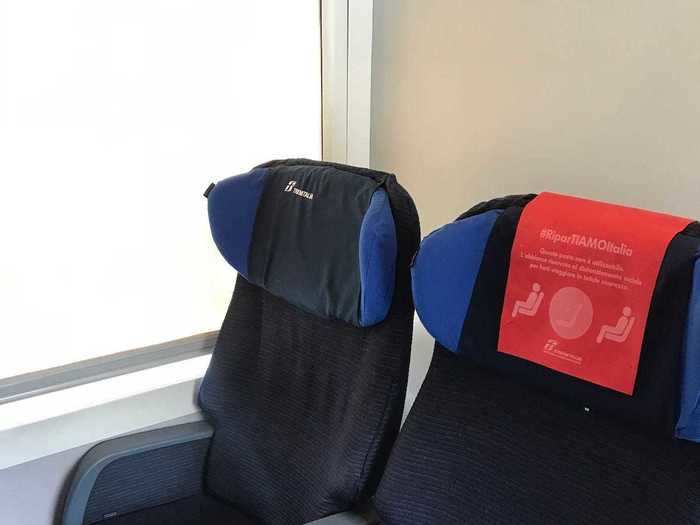 On the train, signs showed travellers where to sit — and masks remained essential.