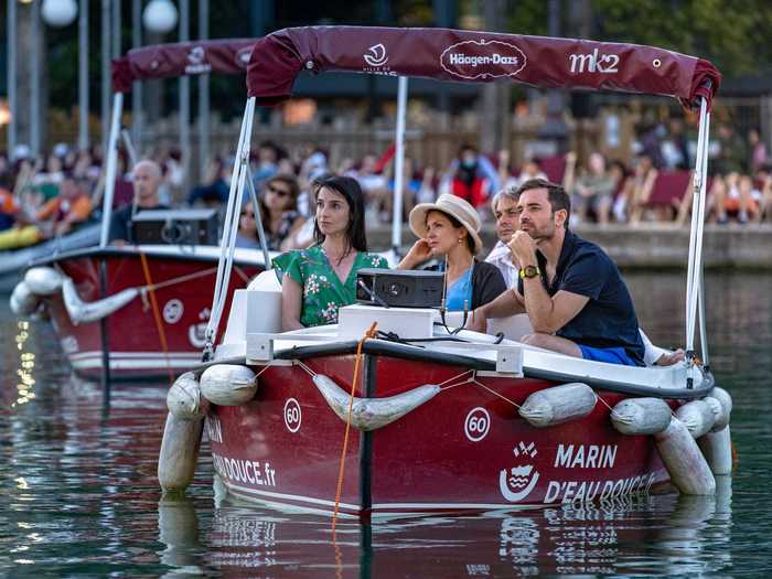 On Saturday, 150 locals watched "Le Grand Bain" from 38 electric boats floating on the water.