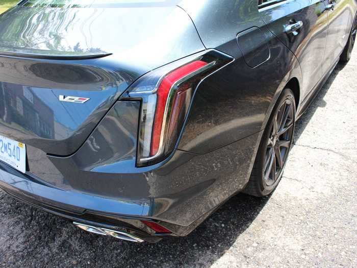 The slim LED headlights are echoed by the equally slender, curving tail lights, hugging the rear fender and suggesting inverted fins, an evocation of Caddy