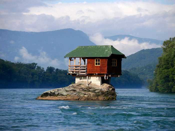 Near the Serbian town of Bajina Basta, a house has stood on top of a rock in the middle of the River Drina for 50 years.