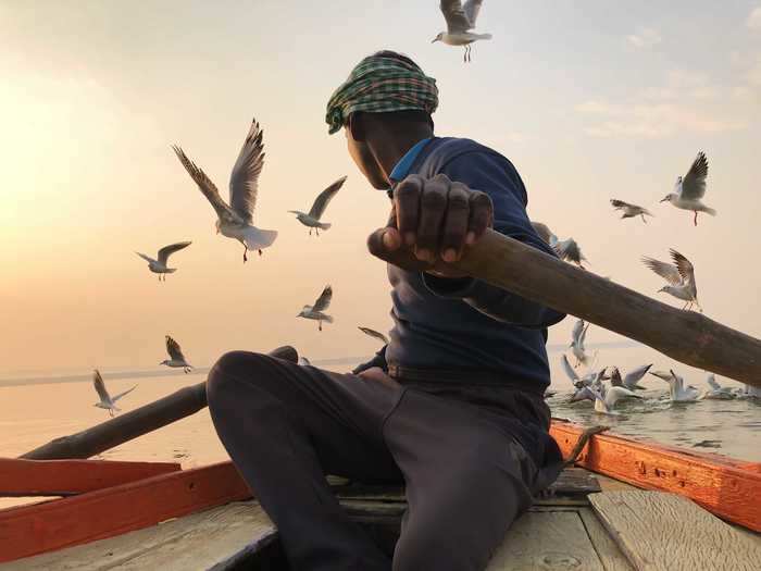 Kristian Cruz, from the US, took home the Travel win for a photo of a man rowing a boat with birds in the background.