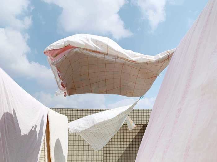 Geli Zhao, from China, won second place in the Photographer of the Year category for an image of sheets blowing in the wind.