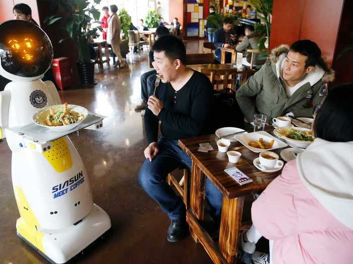 There are many restaurants around the world that utilize waiter robots, including this one in Qingdao, China. "Tete" delivers food to guests and can speak over 200 words.