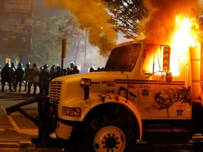 Police in Richmond, Virginia, declared assemblies unlawful after trucks and restaurants were set ablaze and officers said they were pelted with rocks.