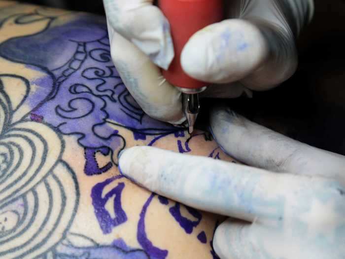 Tipping your tattoo artist is considered polite and standard.