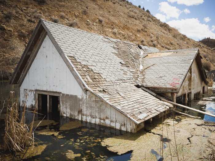 UTAH: Whatever is left of the houses in Thistle remains partially buried due to a landslide.