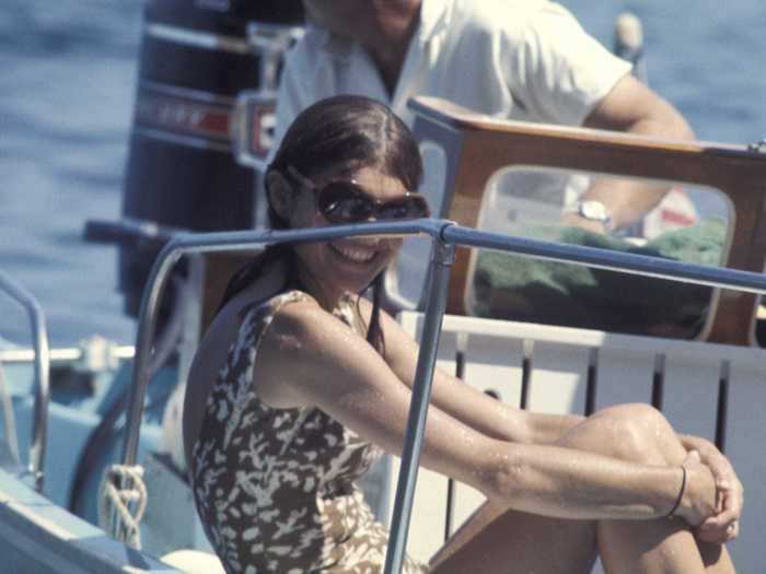 Onassis and Kennedy wed on the island of Skorpios, followed by a lively Mediterranean vacation filled with ocean swims, boating, and relaxation.