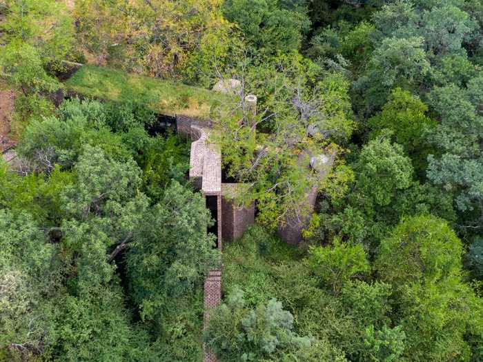 Called The House of the Big Arch, it weaves between the red sandstone cliffs and riverine forest of the Waterberg Reserve about three hours north of the city.