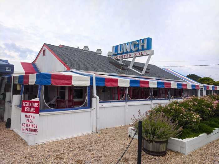 The Lobster Roll oozes Americana with its patriotic red, white, and blue awning. It features a beautiful, plant-covered outdoor patio that makes you forget just how close to the highway you