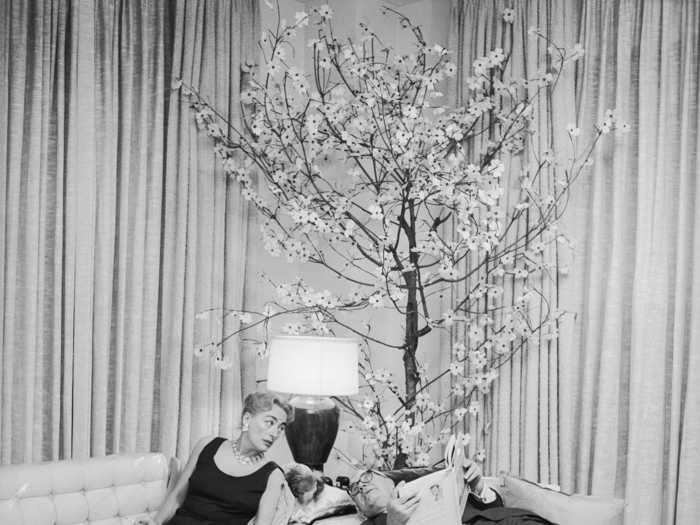 Later in life, Crawford was photographed at home with her husband, Alfred Steele.