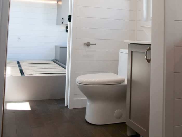 Moving along, the bathroom has a traditional sink, toilet, and shower.