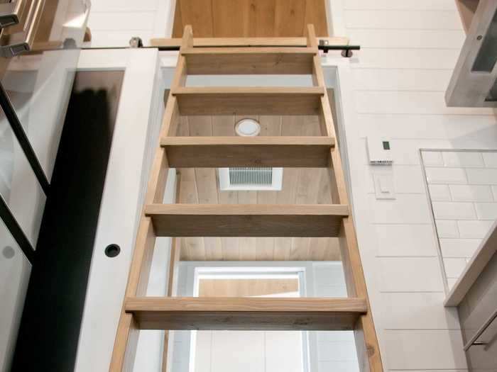 The upstairs loft, which can be accessed with a ladder stored beside the refrigerator, is used primarily for storage.