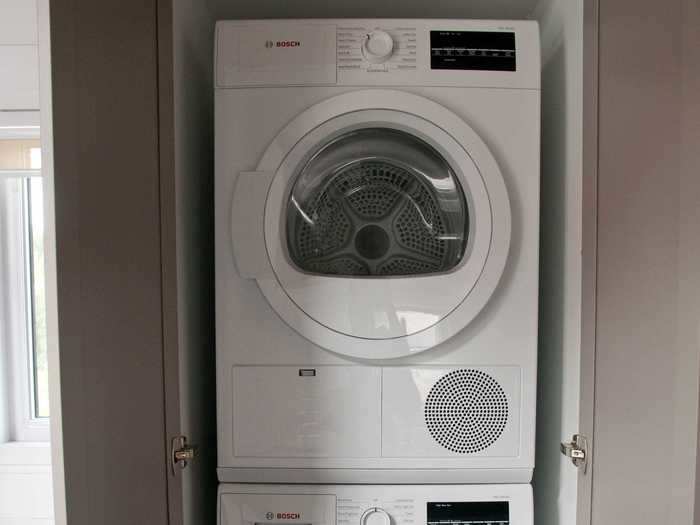 The breakfast nook also has the washer and dryer valves, although the actual washer and dryer units are stacked and hidden behind a cabinet door beside the nook.