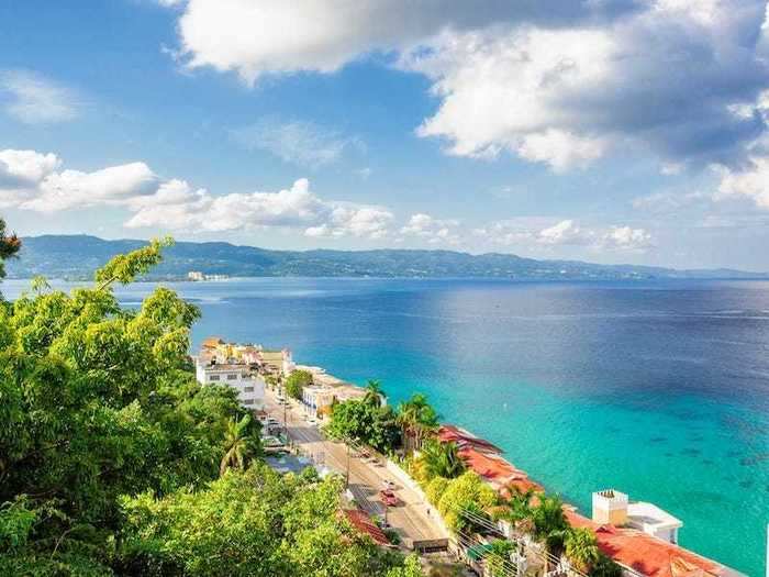 Travelers can sip rum punches from the beaches of Jamaica.