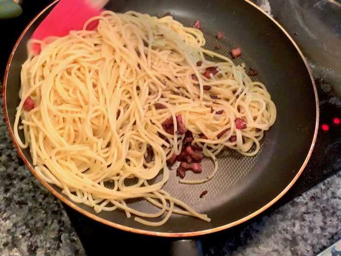 After draining the pasta, I tossed it in the pan with my peppercorns and pancetta.