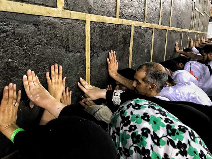 During the Hajj, travelers take part in prayers with other Muslims from across the world. They engage in rituals like stoning a wall and walking to different spots of religious significance in "solidarity with Abraham who is seen as the father of monotheism," Dr. Ibrahim Moosa of Notre Dame University told Newsweek in 2018.