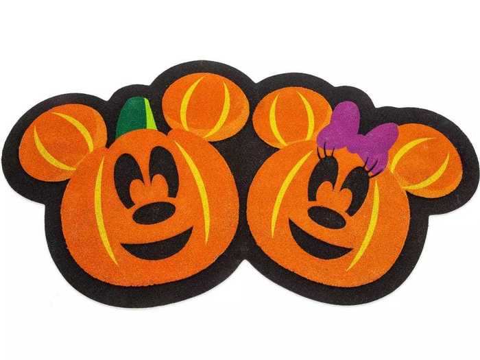 Make your guests feel the Halloween spirit before they even enter your house with this doormat.