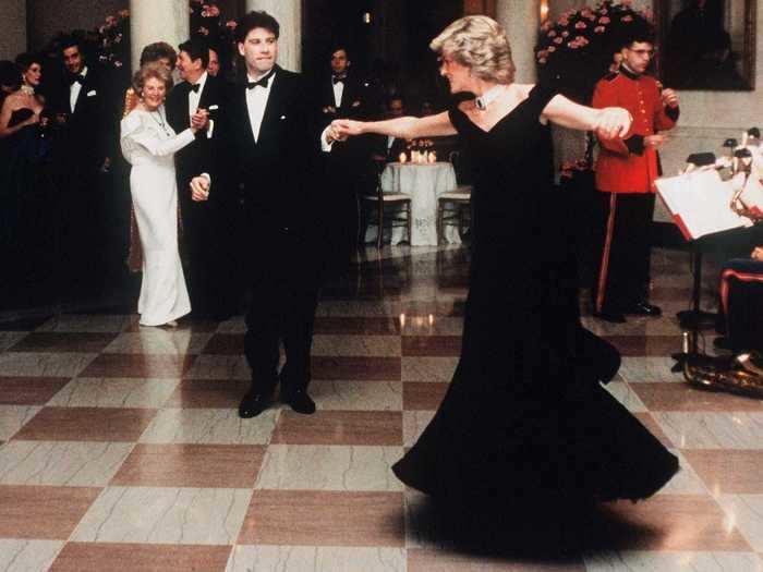 She danced with John Travolta in an elegant velvet gown.