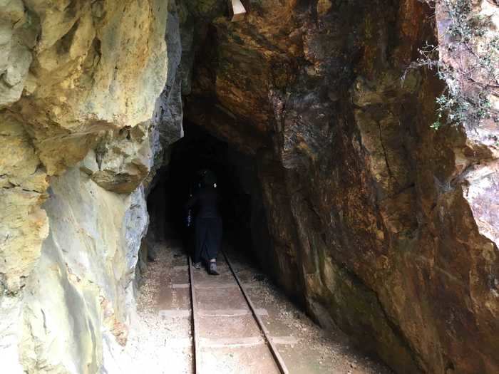 When we followed the tracks to the mining tunnels, it became clear why the sign at the entrance had advised bringing a flashlight.