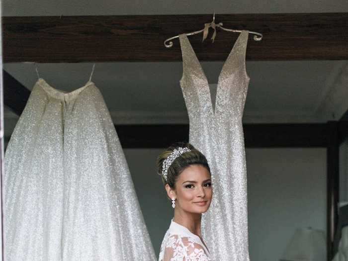 Nasui paired her wedding day look with a crown and an updo.