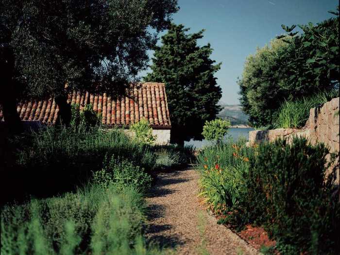 Olive and lemon trees line the pathways to the monastery