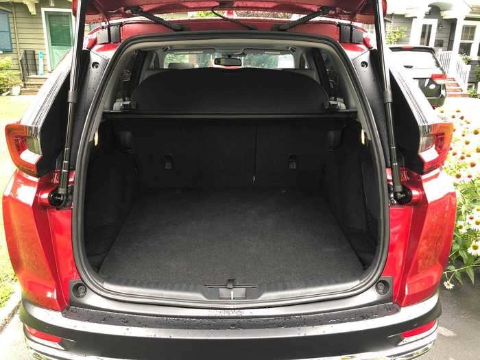 Cargo space is competitive with my RAV4: 33 cubic feet, going up to 69 cubic feet if you drop the rear seats. The carpeted cargo-hold floor would be tougher to clean than my RAV4