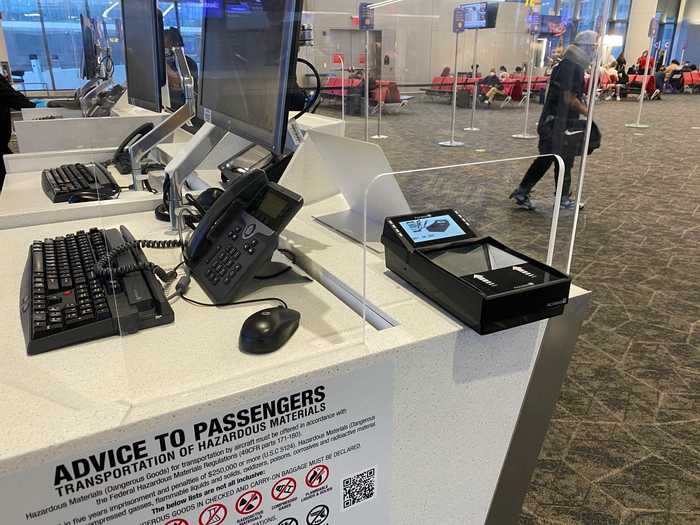 Most gates had these passenger-facing ticket scanners but our flight was boarded with the gate agent manually scanning each ticket with a handheld device.