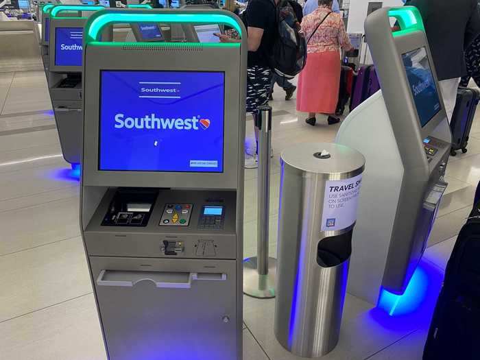 I quickly scanned my mobile boarding pass to get a paper copy. The airport had positioned wipe stations right next to the kiosks.