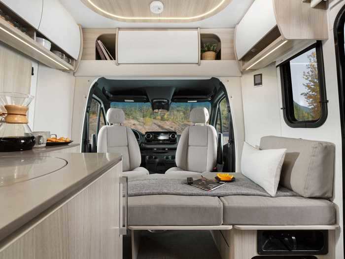 The $142,935 Rear Lounge comes with floor-to-ceiling windows, an optional inflatable bed by the front of the RV …