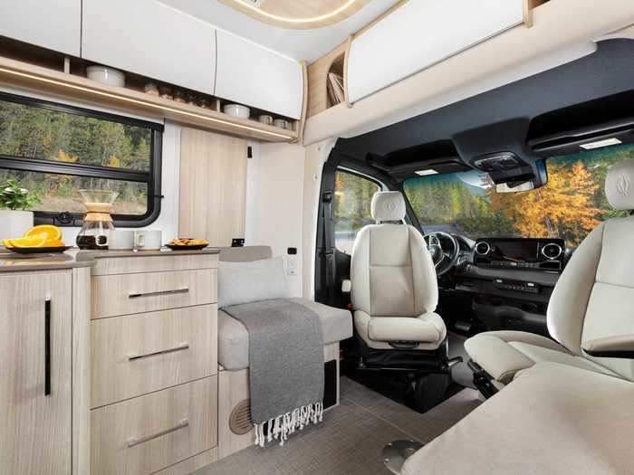 The driver and passenger seats are both heated and can swivel to face the interior of the van, allowing them to serve as extra seats at the dining table for certain floor plans.