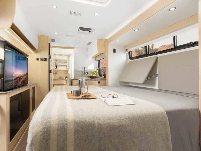 Entertainment options onboard include a bluetooth-capable sound bar and several television screens around the tiny home on wheels.