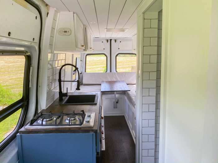 When selecting and renovating their van, Nate and Kara prioritized having a work station, a bathroom, and securing their electronics.