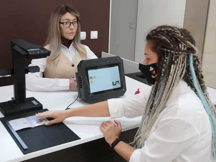 The robot works in a government facility, answering questions previously handled by a person.