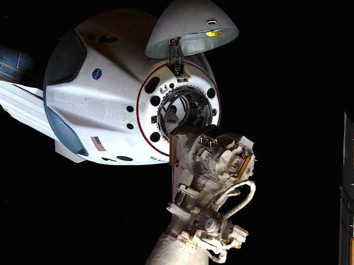 The next day, Endeavour opened its nose cone and docked to the space station.