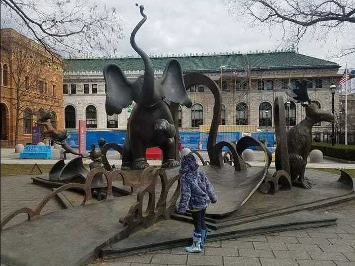 Outside of the Amazing World of Dr. Seuss Museum, there are giant sculptures of Dr. Seuss