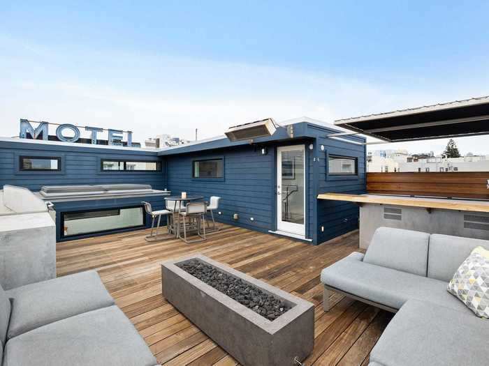 The bar, grill, and seating make large roof deck an ideal place to have a socially distant gathering.