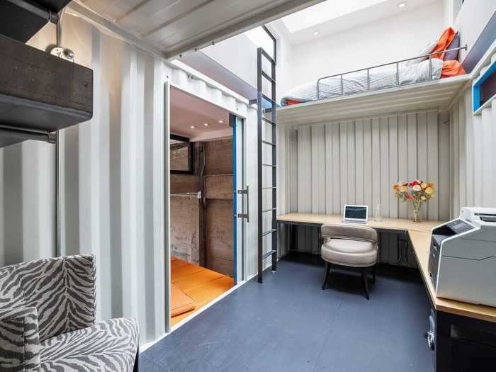 The container also has a small lofted sleeping area inside, for late working nights.