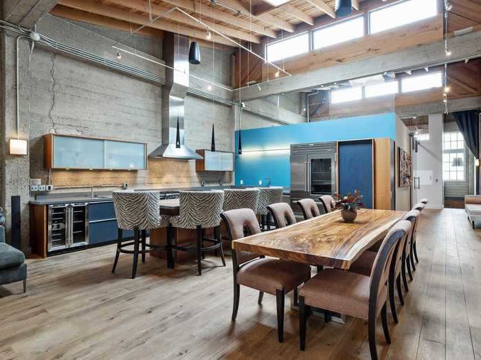 The kitchen is part of the large open living space with the living room.