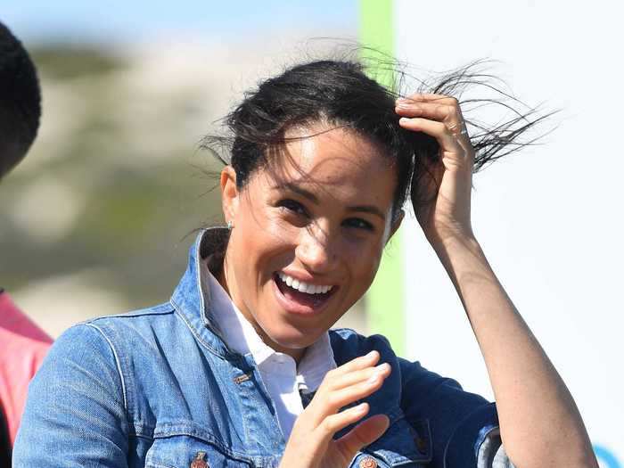 Markle wore a denim jacket and white button-down shirt for a comfortable look while visiting Cape Town, South Africa, on the royal tour in September 2019.