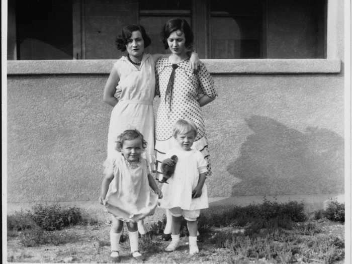 Here, Norma Jeane Baker is pictured bottom right with her mother Gladys Baker and some family friends.