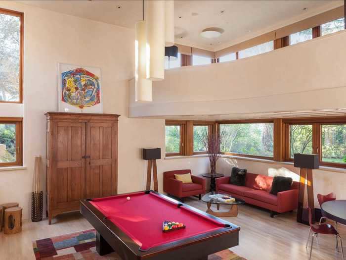 The home was designed with abundant space for entertaining, like this billiards room ...